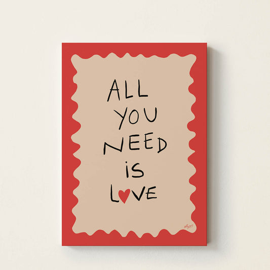 Hand-drawn typography poster displaying the words “All You Need Is Love” with a small red heart, black lettering, a neutral centre, and a bold red wavy border.