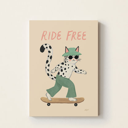 Hand-drawn spotted cat wearing sunglasses and a green bucket hat riding a skateboard beneath the words "Ride Free", whimsical kids wall art for nurseries, bedrooms, and playrooms.