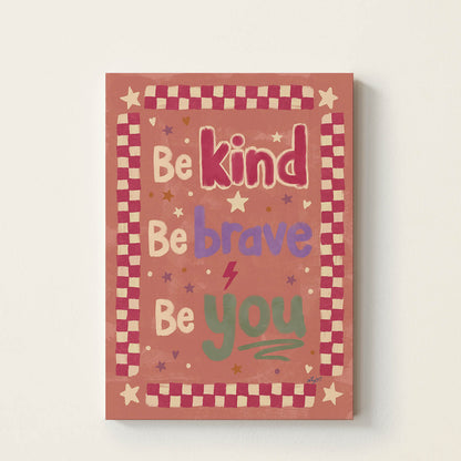 Hand-drawn typography poster featuring the inspirational message "Be Kind, Be Brave, Be You" in colourful retro lettering with a vintage checkerboard border, kids wall art for nurseries, bedrooms, playrooms, and classrooms.