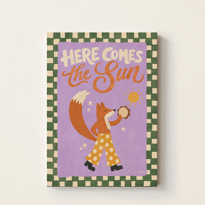 Hand-drawn fox holding a tambourine beneath the phrase Here Comes The Sun, cheerful inspirational wall art for nurseries, bedrooms, and playrooms.