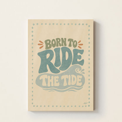Hand-drawn retro typography poster featuring the inspirational surf phrase "Born to Ride the Tide" in soft coastal colours, perfect for nurseries, bedrooms, playrooms, and beach-inspired kids' spaces.