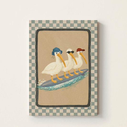 Hand-drawn illustration of three pelicans wearing hats and sunglasses riding a surfboard together on a wave, whimsical coastal wall art for nurseries, bedrooms, and playrooms.