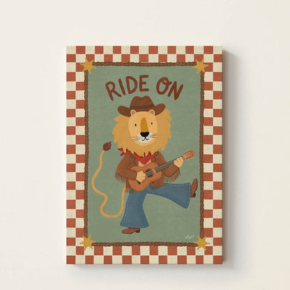 Hand-drawn lion dressed as a cowboy playing an acoustic guitar beneath the words "Ride On", western-inspired wall art for nurseries, children's bedrooms, playrooms, and music rooms.