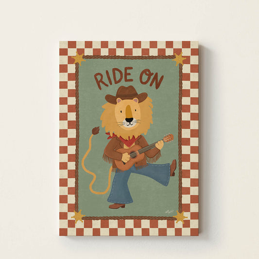 Hand-drawn lion dressed as a cowboy playing an acoustic guitar beneath the words "Ride On", western-inspired wall art for nurseries, children's bedrooms, playrooms, and music rooms.