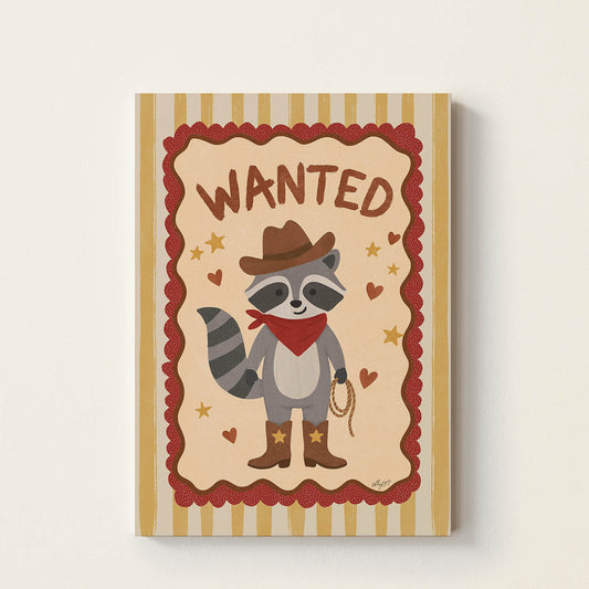 Hand-drawn raccoon dressed as a cowboy wearing boots, a hat, and a bandana beneath the word "Wanted", western-inspired wall art for nurseries, children's bedrooms, playrooms, and reading corners.