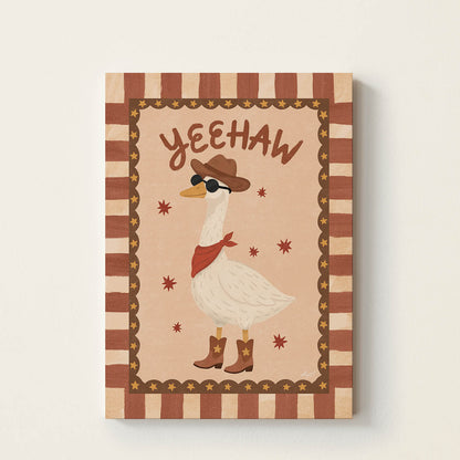 Hand-drawn goose dressed as a cowboy wearing a western hat, bandana, boots, and sunglasses beneath the word "Yeehaw", retro western wall art for nurseries, children's bedrooms, playrooms, and reading corners.
